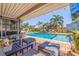 Outdoor pool and covered patio are ready for entertaining at 2401 66Th S Ave, St Petersburg, FL 33712