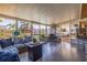 Enclosed sunroom with comfortable seating overlooking the sparkling backyard pool area at 2401 66Th S Ave, St Petersburg, FL 33712