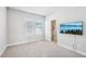 Neutral bedroom with TV, ample space, and bright, sunny windows at 2511 N Grady Ave # 41, Tampa, FL 33607