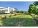 Well maintained green space surrounded by manicured landscaping, modern buildings, and a clear blue sky at 2511 N Grady Ave # 41, Tampa, FL 33607