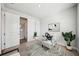 Bright office space with a transparent desk, white walls, and a view to an en-suite bathroom at 2511 N Grady Ave # 41, Tampa, FL 33607