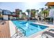Resort-style pool with sun loungers, tables and seating for residents' relaxation at 2511 N Grady Ave # 41, Tampa, FL 33607