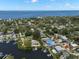 Aerial view showcasing the property's location with canal access to the bay at 261 Kentucky Ave, Crystal Beach, FL 34681