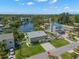 An aerial view captures the home's location on a waterfront canal, showcasing the property's access to waterways at 261 Kentucky Ave, Crystal Beach, FL 34681