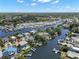 Aerial view highlighting the property's desirable location near winding canals and lush landscaping at 261 Kentucky Ave, Crystal Beach, FL 34681