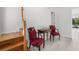 Elegant entryway features a wooden staircase, seating, and decor, offering a warm welcome at 261 Kentucky Ave, Crystal Beach, FL 34681