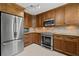 Inviting kitchen with stainless steel appliances, ample counter space, and plenty of cabinetry at 261 Kentucky Ave, Crystal Beach, FL 34681