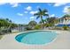 Sparkling in-ground pool with picturesque water views and lush surroundings at 261 Kentucky Ave, Crystal Beach, FL 34681