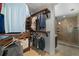 Spacious walk-in closet with custom shelving and a full-size shower room located next to the closet area at 261 Kentucky Ave, Crystal Beach, FL 34681
