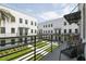 Modern apartments with black railings and green grass area, for a stylish and inviting outdoor experience at 2758 5Th S Ave, St Petersburg, FL 33712