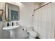Bright bathroom featuring sleek pedestal sink, modern fixtures, and a minimalist aesthetic at 2758 5Th S Ave, St Petersburg, FL 33712