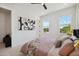Well-lit bedroom showcasing art, views and a comfortable, inviting atmosphere at 2758 5Th S Ave, St Petersburg, FL 33712