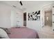 Bedroom with modern decor, connecting to a well-lit bathroom with neutral tones at 2758 5Th S Ave, St Petersburg, FL 33712