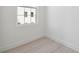 Bright bedroom featuring light wood floors, white walls, and a large window offering natural light at 2758 5Th S Ave, St Petersburg, FL 33712