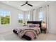 Bright bedroom featuring large windows, a ceiling fan and a decorative rug at 2758 5Th S Ave, St Petersburg, FL 33712