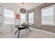 Bright dining room with modern chandelier, concrete block wall and white accents at 2758 5Th S Ave, St Petersburg, FL 33712
