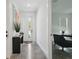 Bright entryway showcasing polished concrete floors, modern console table, and a glimpse into the office space at 2758 5Th S Ave, St Petersburg, FL 33712