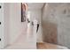 Hallway features modern artwork, stairs and a concrete wall, adding architectural detail at 2758 5Th S Ave, St Petersburg, FL 33712