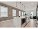 Modern kitchen with concrete accent wall, quartz countertops, and stainless steel appliances at 2758 5Th S Ave, St Petersburg, FL 33712
