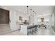 Contemporary kitchen with white cabinetry, quartz countertops, and modern bar stool seating at 2758 5Th S Ave, St Petersburg, FL 33712