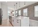 Contemporary kitchen island with breakfast bar seating, stainless appliances, and ample storage at 2758 5Th S Ave, St Petersburg, FL 33712