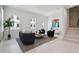 Bright living room with modern decor, neutral palette, light wood flooring, and ample natural light at 2758 5Th S Ave, St Petersburg, FL 33712