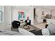 Chic living room with colorful artwork, plush seating, and staircase to upper level at 2758 5Th S Ave, St Petersburg, FL 33712