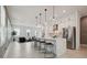Open-concept living space featuring kitchen island, modern seating, and neutral color palette at 2758 5Th S Ave, St Petersburg, FL 33712