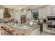 Well-equipped kitchen featuring an island with seating, modern appliances, and ample counter space at 29807 Imperati Blvd, Wesley Chapel, FL 33543
