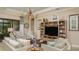 Spacious living room with comfortable seating, built-in shelving and neutral colors at 29807 Imperati Blvd, Wesley Chapel, FL 33543