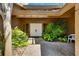 Welcoming front entrance featuring double doors and decorative landscaping at 29903 Baywood Ln, Wesley Chapel, FL 33543