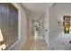 Bright hallway with tiled floor and multiple doorways at 29903 Baywood Ln, Wesley Chapel, FL 33543