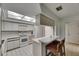 Modern kitchen with white cabinets, a breakfast bar, and a skylight above at 29903 Baywood Ln, Wesley Chapel, FL 33543