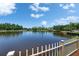 Scenic lake view from a deck with white metal railing at 29903 Baywood Ln, Wesley Chapel, FL 33543