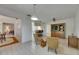 Open-concept living room featuring a built-in media cabinet and views into kitchen at 29903 Baywood Ln, Wesley Chapel, FL 33543