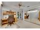 Office space with built-in desk, a ceiling fan, and mirrored closet doors at 29903 Baywood Ln, Wesley Chapel, FL 33543