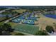 Aerial view of the tennis and sports center offering multiple courts and a football field at 29903 Baywood Ln, Wesley Chapel, FL 33543