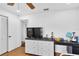 Bright bedroom with a ceiling fan, white walls, and wood flooring offers plenty of space at 30 Pinetree Ct, Palm Harbor, FL 34683