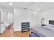 Neutral bedroom featuring hardwood floors, a closet, and a large window at 30 Pinetree Ct, Palm Harbor, FL 34683