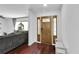 Elegant foyer with hardwood floors, decorative front door, and bright natural light at 30 Pinetree Ct, Palm Harbor, FL 34683