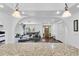 Open living space with hardwood floors and arched entryways, showcasing a view to the front door at 30 Pinetree Ct, Palm Harbor, FL 34683