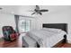 Bedroom with hardwood floors, pool view, and modern furnishings at 30 Pinetree Ct, Palm Harbor, FL 34683