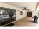 Spacious covered patio with ceiling fans, brick flooring, and a view of the pool at 30 Pinetree Ct, Palm Harbor, FL 34683