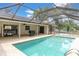 Beautifully maintained pool with screened enclosure, offering a relaxing outdoor space at 30 Pinetree Ct, Palm Harbor, FL 34683