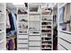 Spacious walk-in closet offering custom shelving, drawers, and ample storage for clothes and accessories at 30 Pinetree Ct, Palm Harbor, FL 34683