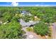 Wide aerial view of the sprawling property showing lush surroundings at 3440 Crenshaw Lake Rd, Lutz, FL 33548