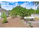 View of chicken coop in the backyard with a mulched area and various trees at 3440 Crenshaw Lake Rd, Lutz, FL 33548