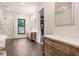 A bright bathroom equipped with double vanities, a shower, and a soaking tub at 3440 Crenshaw Lake Rd, Lutz, FL 33548
