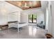 Bedroom featuring modern decor, polished concrete floors, wood ceilings, and natural light at 3440 Crenshaw Lake Rd, Lutz, FL 33548