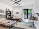 Bright, modern bedroom with two metal-framed beds and a large window at 3440 Crenshaw Lake Rd, Lutz, FL 33548